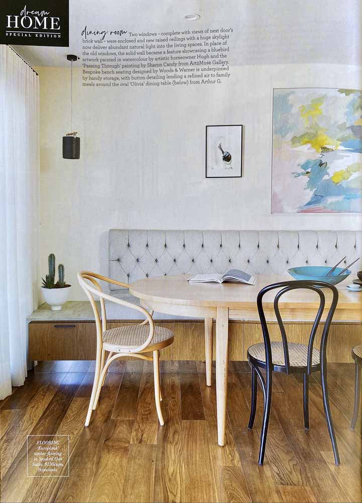 Image of Australian Home Beautiful Magazine article that discusses home interior design and renovations. This particular image features a timber kitchen table with chairs and a paintings on the wall.